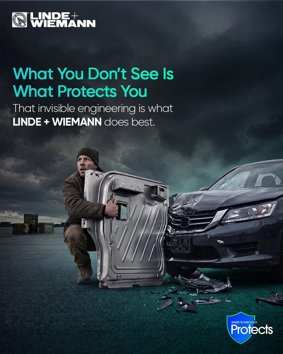 Advert showing a man in work clothes lifting a large car door panel beside a damaged SUV on a stormy lot, promoting Linde + Wiemann's invisible engineering.