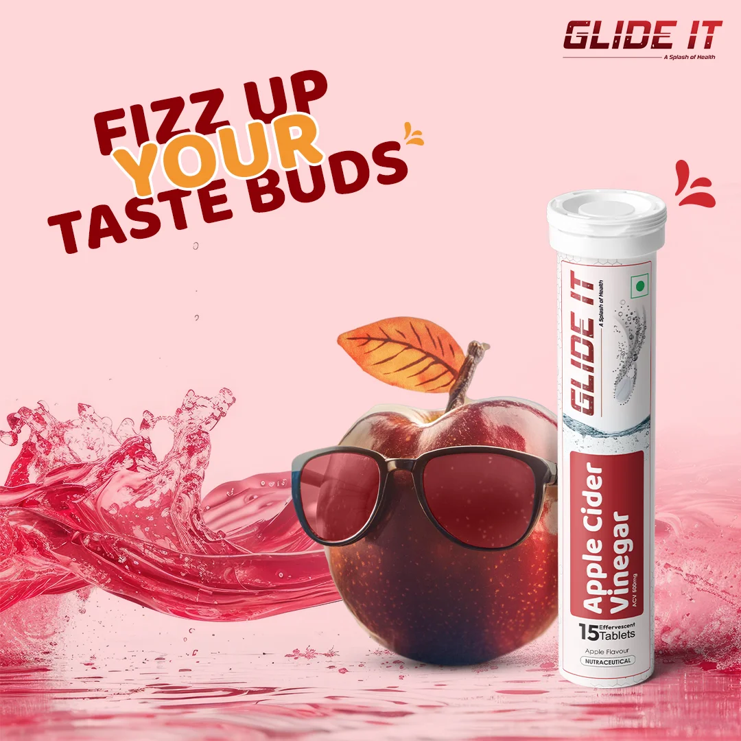 Advertising image for Glide It Apple Cider Vinegar effervescent tablets; pink splash background, an apple with sunglasses, and a labeled tube nearby.